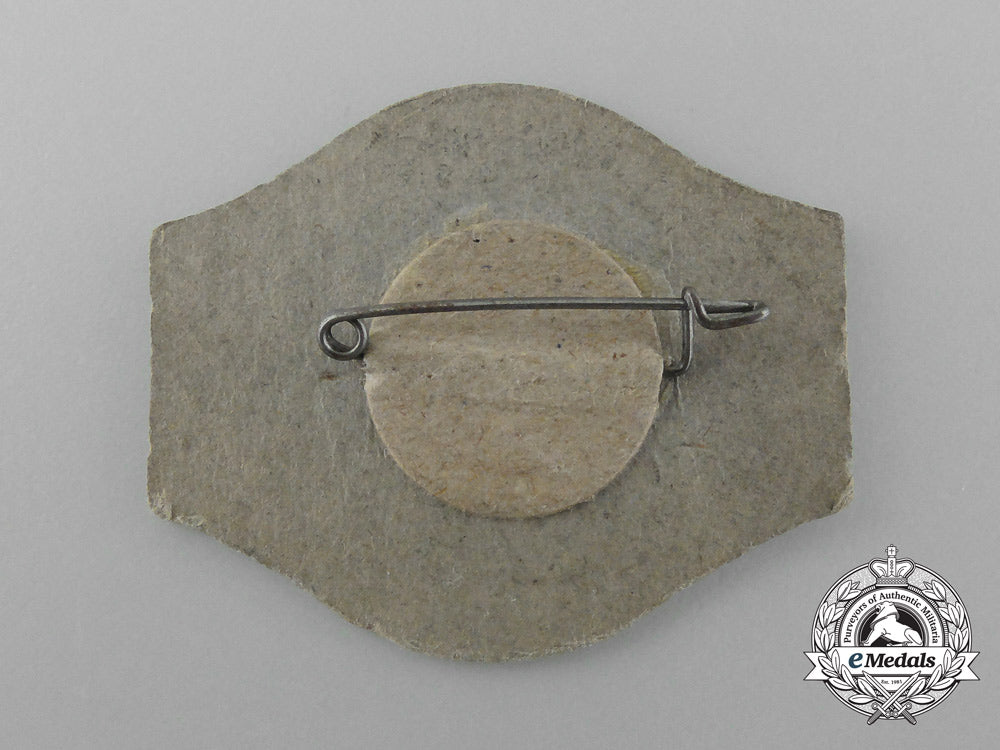 germany,_third_reich._a1936_neuland“_day_of_national_solidarity”_badge_d_9877