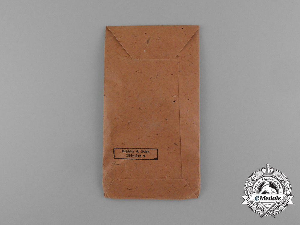 an_absolutely_mint_war_merit_cross_with_swords_in_its_original_packet_of_issue_by_deschler&_sohn_d_9911_1