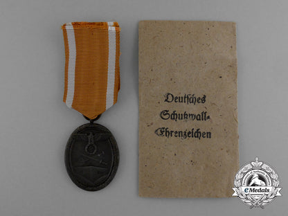 a_west_wall_medal_in_its_original_packet_of_issue_by_karl_poellath_of_schrobenhausen_d_9975