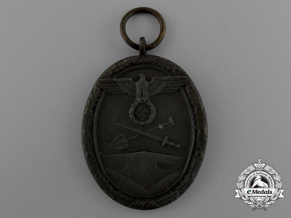 a_west_wall_medal_in_its_original_packet_of_issue_by_karl_poellath_of_schrobenhausen_d_9977