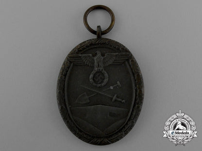a_west_wall_medal_in_its_original_packet_of_issue_by_karl_poellath_of_schrobenhausen_d_9977