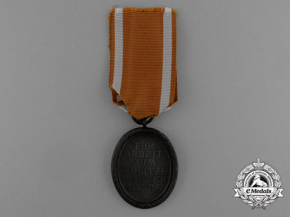 a_west_wall_medal_in_its_original_packet_of_issue_by_karl_poellath_of_schrobenhausen_d_9979