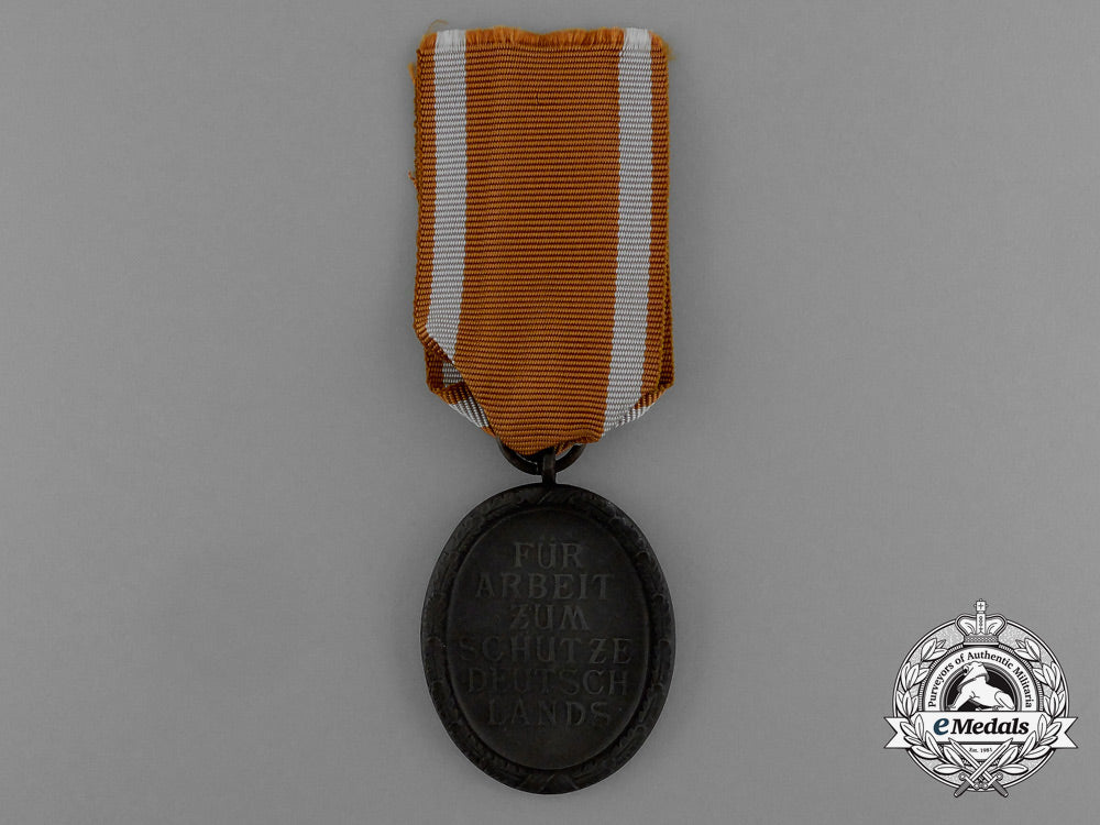 a_west_wall_medal_in_its_original_packet_of_issue_by_karl_poellath_of_schrobenhausen_d_9979