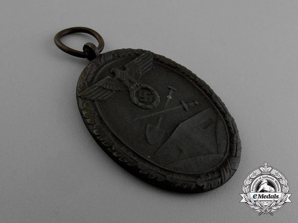 a_west_wall_medal_in_its_original_packet_of_issue_by_karl_poellath_of_schrobenhausen_d_9980