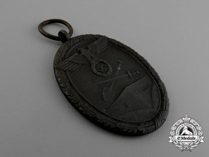 a_west_wall_medal_in_its_original_packet_of_issue_by_karl_poellath_of_schrobenhausen_d_9980