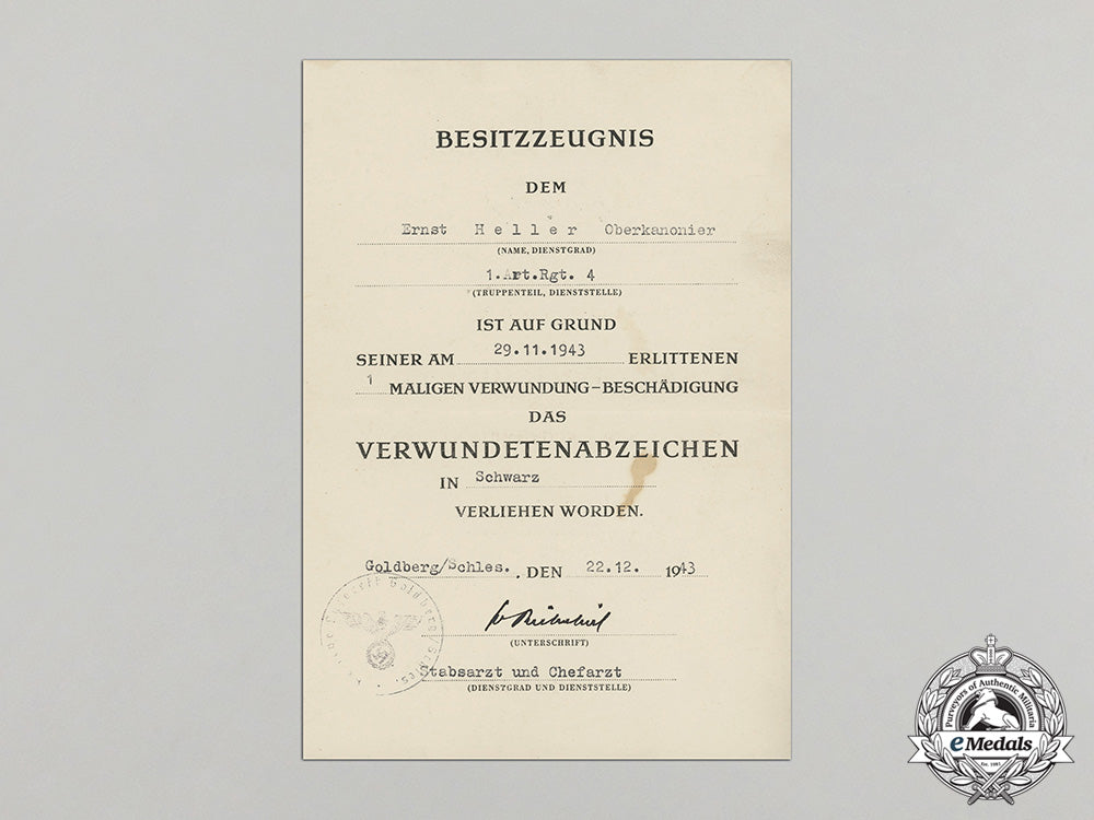 a_wound_badge_in_black_document_to_artillery_senior_gunner_ernst_heller_dd_1370