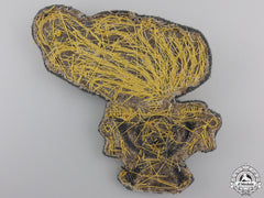 An Italian 2Nd Artillery Cavalry Cap Badge