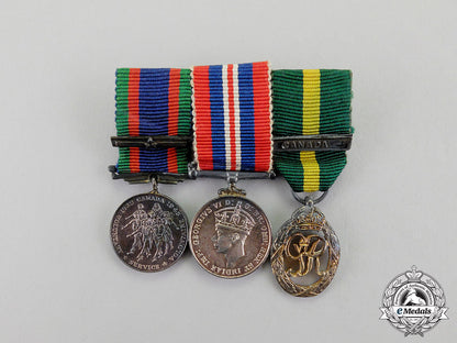 canada._an_efficiency_decoration_trio_to_flight_lieutenant_percy_w._tupper,_rcaf_dscf8070_1