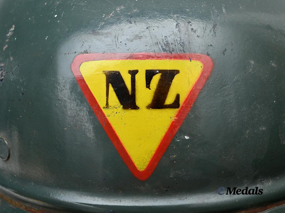 croatia,_independent_state._a_rare_narodna_zaštita_personnel_helmet,_repurposed_luftschutz_example_e_medals__e_u24580_11