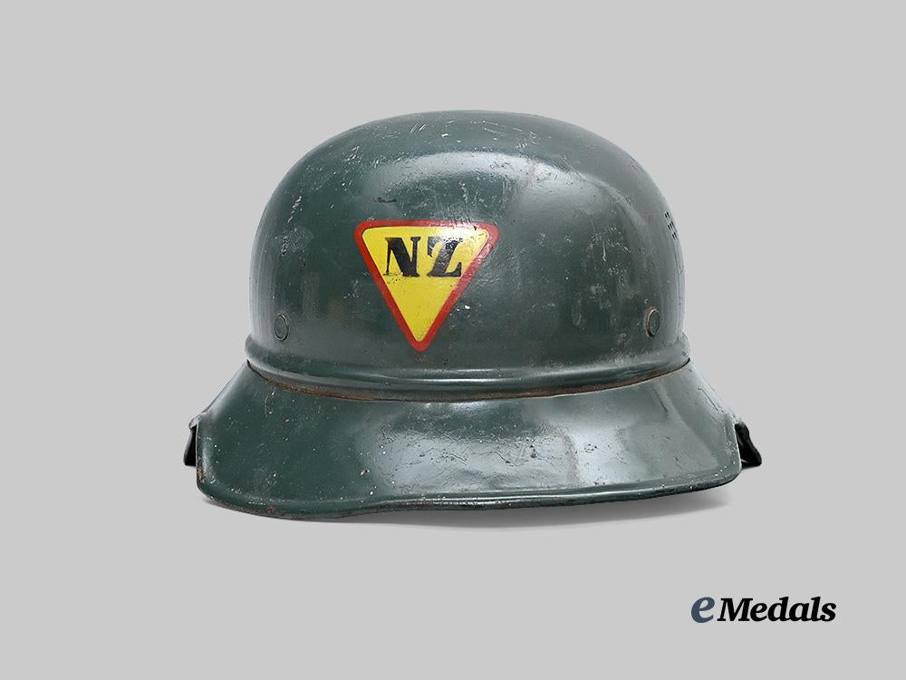 croatia,_independent_state._a_rare_narodna_zaštita_personnel_helmet,_repurposed_luftschutz_example_e_medals__e_u24580_2