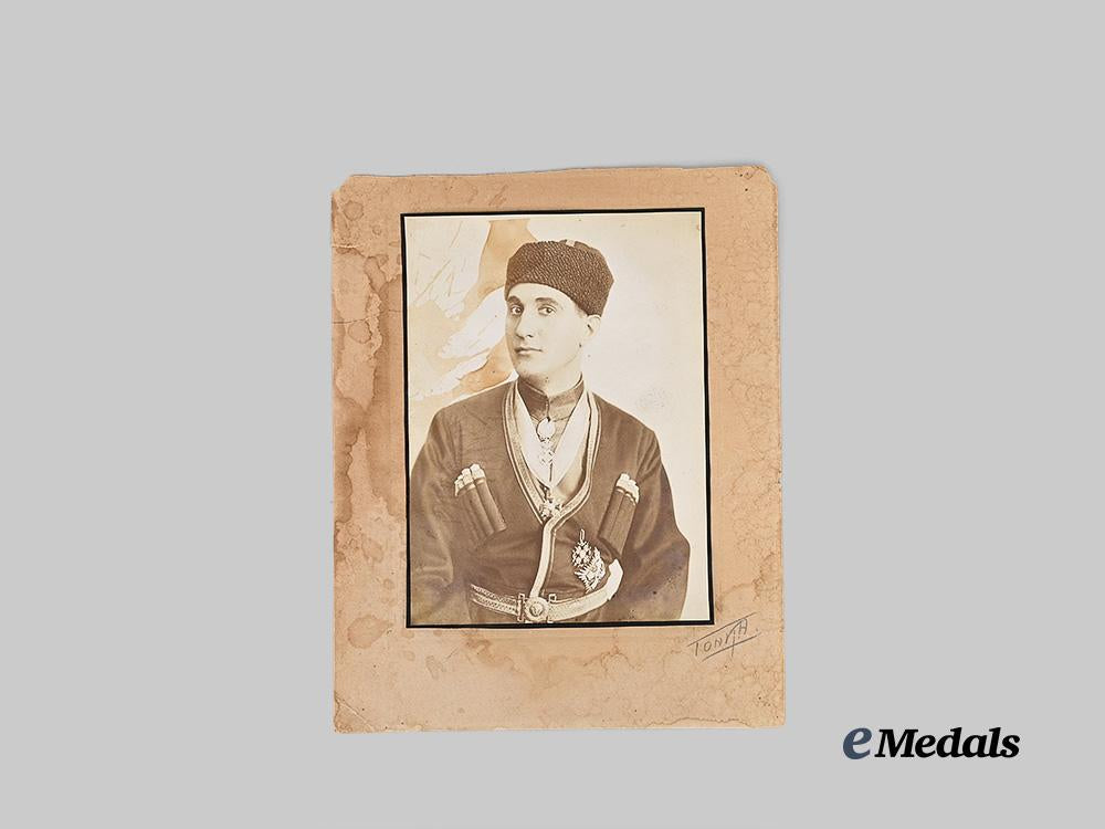 russia,_imperial._a_large_cossack_studio_portrait_with_orders_e_medals__e_u24795_2