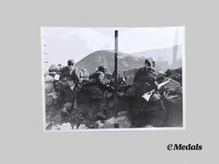 Germany, Wehrmacht. A 1944 Press Photo of Fallschirmjäger Attacking Yugoslav Partisans