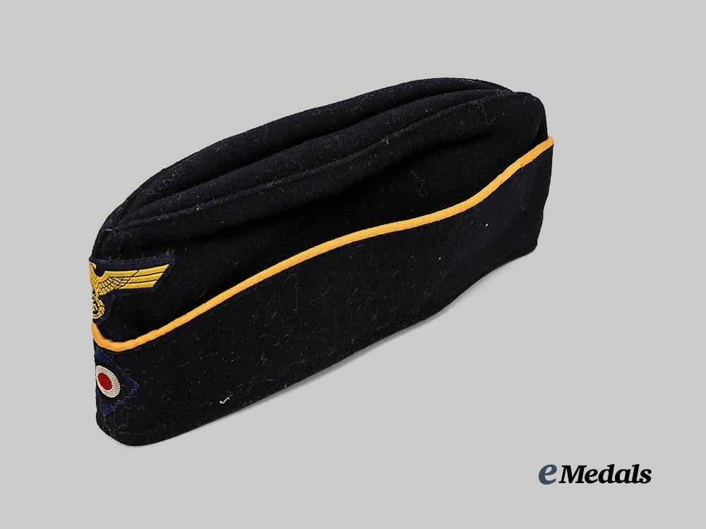 germany,_kriegsmarine._an_officer’s_dark_blue_board_cap,_late-_war_example_e_medals__g61220_6