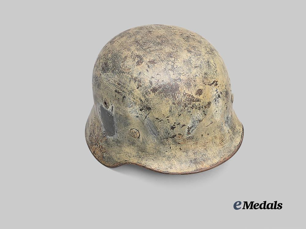 germany,_wehrmacht._an_m35_stahlhelm_with_field-_applied_winter_camouflage,_by_f._w._quist_e_medals__g61230_3