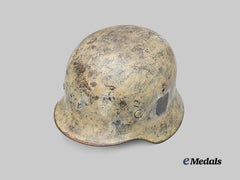 Germany, Wehrmacht. An M35 Stahlhelm with Field-Applied Winter Camouflage, by F.W. Quist