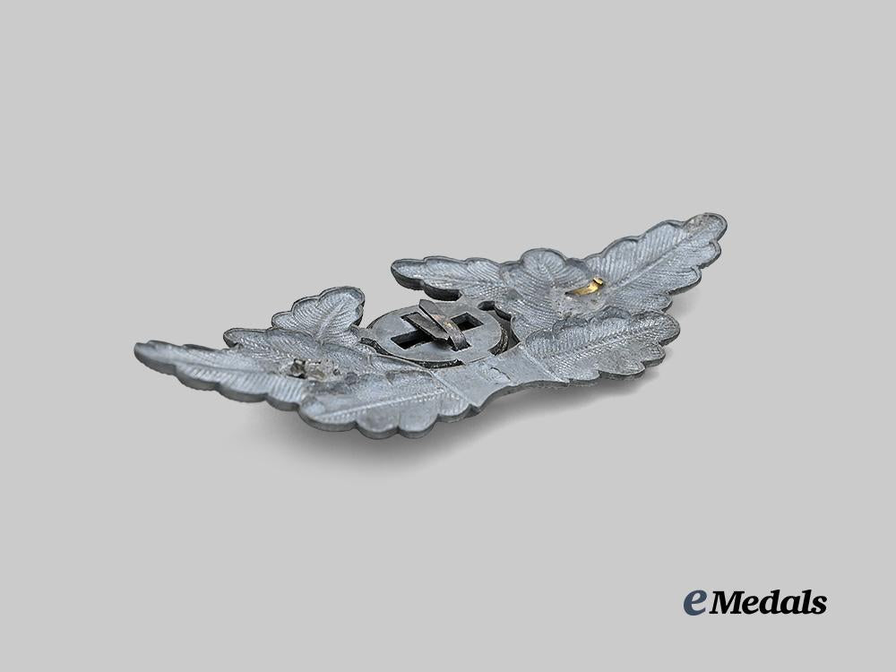 germany,_n_s_d_a_p._a_political_leader’s_visor_cap_wreath_and_cockade_e_medals__g61420_4