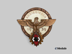 Germany, HJ. A 1939 National Trade Competition Victor’s Badge, Bronze Grade, by Ferdinand Wagner