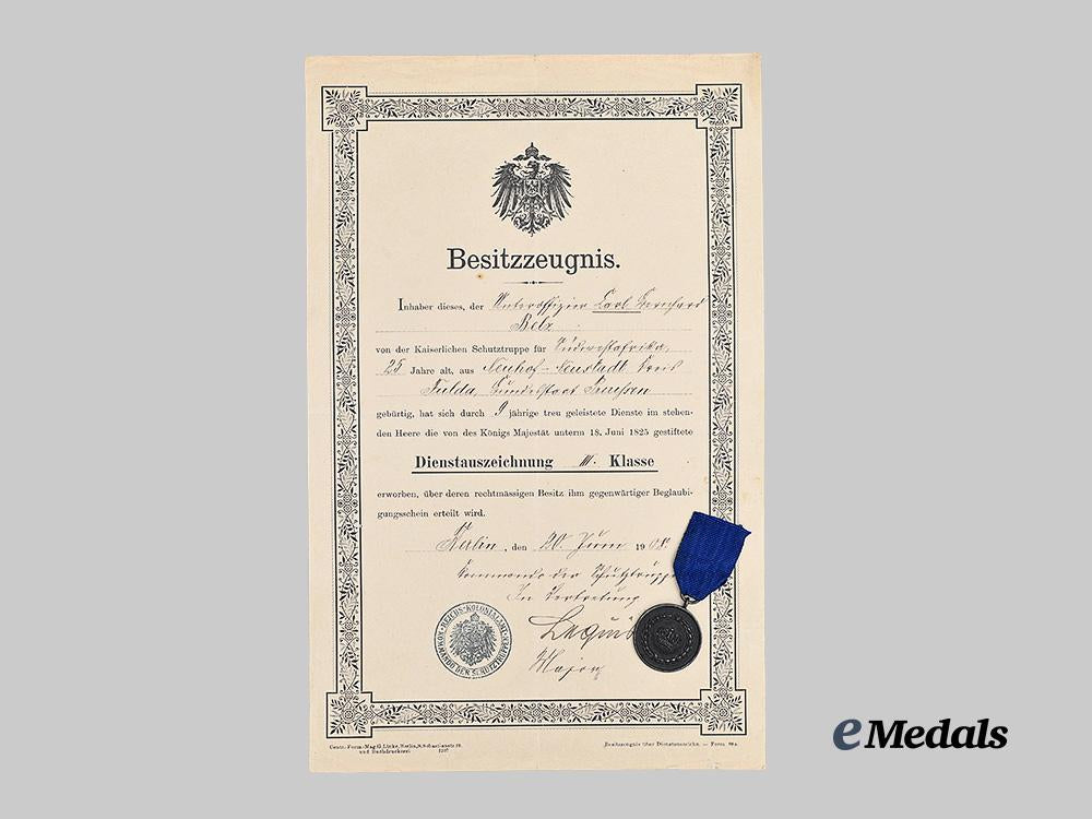 germany,_imperial._a_rare_schutztruppe_long_service_award_document_to_unteroffizier_carl_karl_gerhard_belz,_with_medal_e_medals__g61801_2