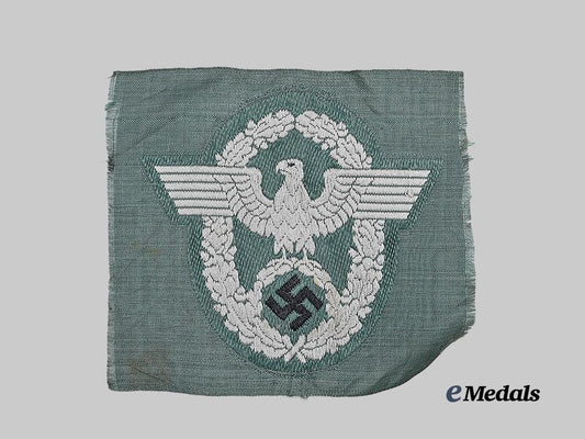 germany,_ordnungspolizei._a_schutzpolizei_sleeve_eagle_for_enlisted_ranks,_be_vo_variant,_unissued_example_e_medals__g62211_2