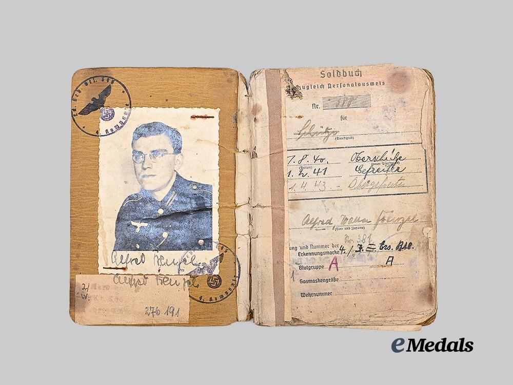 germany,_heer._a_soldbuch_to_alfred_heupel,_decorated_eastern_front_combatant_e_medals__g63194_3