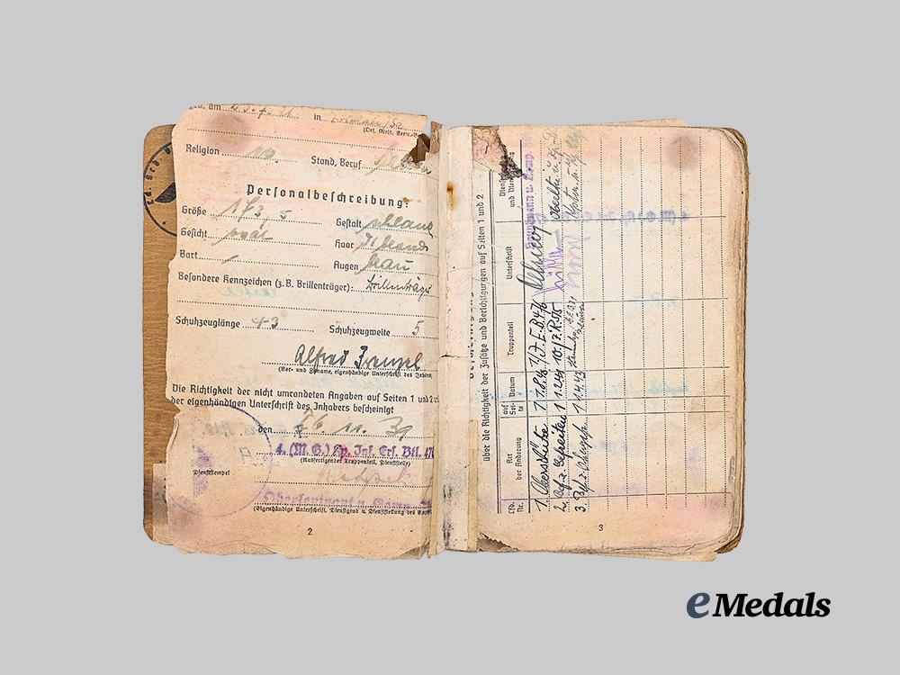 germany,_heer._a_soldbuch_to_alfred_heupel,_decorated_eastern_front_combatant_e_medals__g63194_4