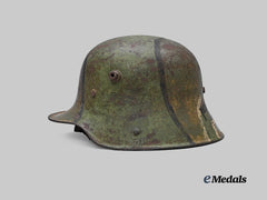 Germany, Imperial. An M16 Camouflage Stahlhelm, Owner-Attributed Example, by Gebrüder Gnüchtel A.G.