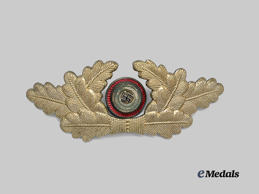 germany,_n_s_d_a_p._a_political_leader’s_visor_cap_wreath_and_cockade,_r_z_m_marked_examples_e_medals__g64079_2