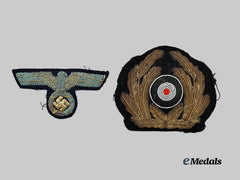 Germany, Kriegsmarine. A Pair of Visor Cap Insignia for Officer Ranks