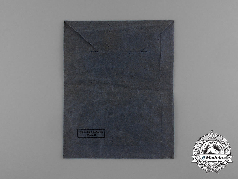 an_austrian_made_iron_cross1939_second_class_by_friedrich_orth_in_its_original_packet_of_issue_e_0040