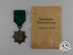 A Bronze Grade Ostvolk Merit Medal With Swords In Its Original Packet Of Issue By Rudolf Wächtler & Lange