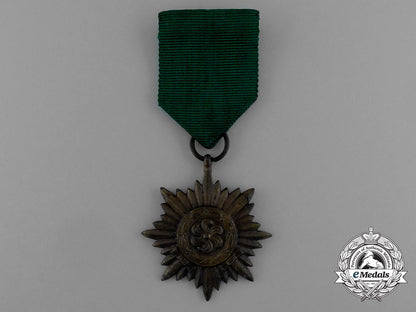 a_bronze_grade_ostvolk_merit_medal_with_swords_in_its_original_packet_of_issue_by_rudolf_wächtler&_lange_e_0048