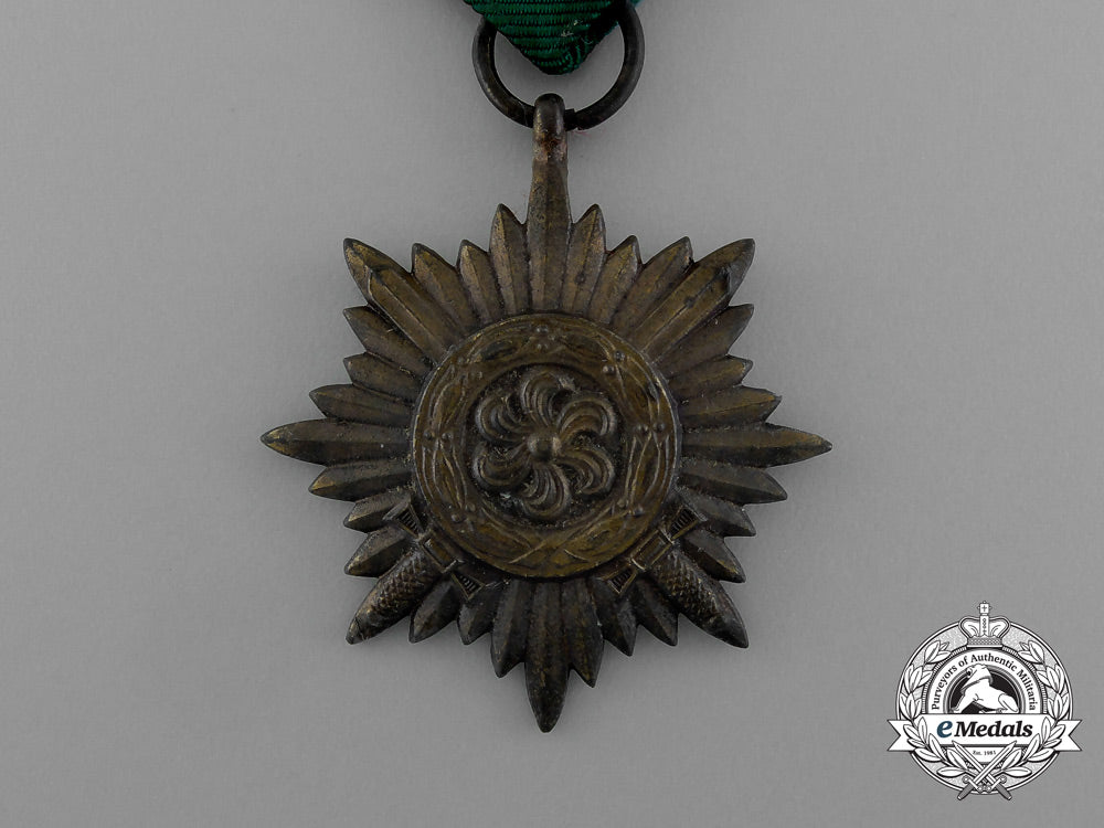 a_bronze_grade_ostvolk_merit_medal_with_swords_in_its_original_packet_of_issue_by_rudolf_wächtler&_lange_e_0049