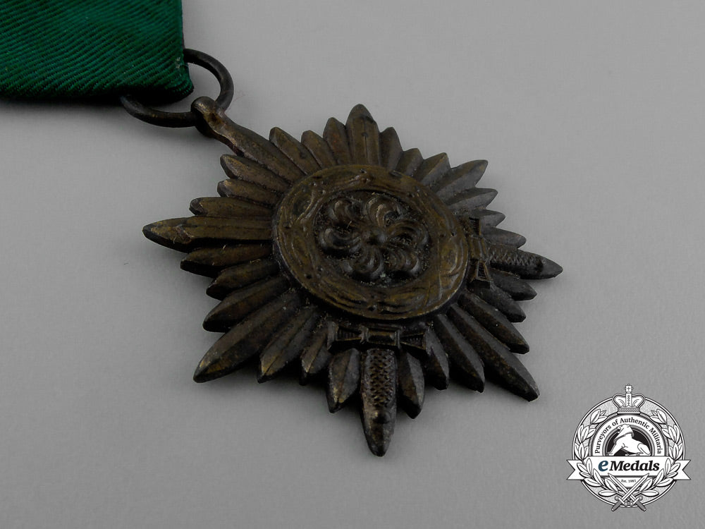 a_bronze_grade_ostvolk_merit_medal_with_swords_in_its_original_packet_of_issue_by_rudolf_wächtler&_lange_e_0051