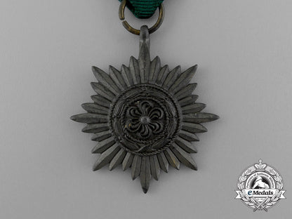 germany,_heer._a_bronze_grade_ostvolk_merit_medal_in_its_original_packet_of_issue_e_0476