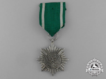 a_silver_grade_eastern_people_bravery_decoration;2_nd_class_in_its_original_packet_of_issue_e_1016