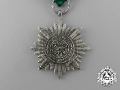 a_silver_grade_eastern_people_bravery_decoration;2_nd_class_in_its_original_packet_of_issue_e_1017