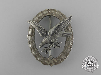 an_early_quality_cased_luftwaffe_radio_operator&_air_gunner_badge_by_c._e._juncker_e_1853
