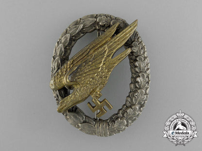 an_early_quality_cased_luftwaffe_paratrooper/_fallschirjäger_badge_by_c._e._juncker_e_1869