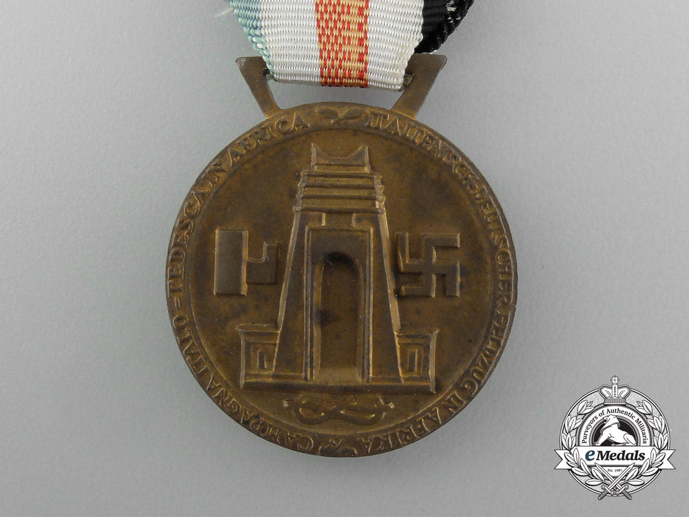a_german-_italian_africa_campaign_medal_with_its_original_packet_of_issue_by_lorioli_fratelli_e_3979