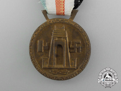 a_german-_italian_africa_campaign_medal_with_its_original_packet_of_issue_by_lorioli_fratelli_e_3979