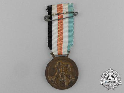 a_german-_italian_africa_campaign_medal_with_its_original_packet_of_issue_by_lorioli_fratelli_e_3981