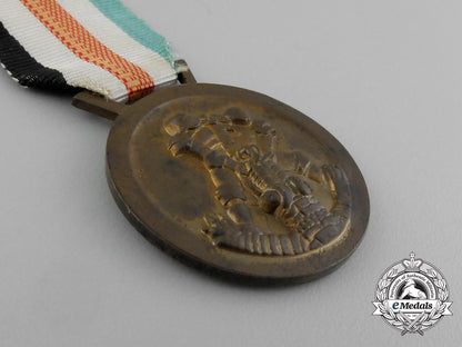 a_german-_italian_africa_campaign_medal_with_its_original_packet_of_issue_by_lorioli_fratelli_e_3982