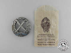 A Second War Italian Russian Front Honour Badge By Lorioli Fratelli In Its Original Packet Of Issue