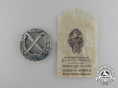 A Second War Italian Russian Front Honour Badge By Lorioli Fratelli In Its Original Packet Of Issue