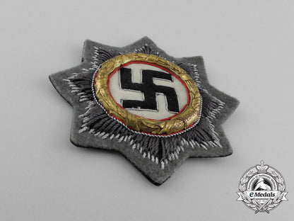 a_mint_wehrmacht_heer(_army)_issue_german_cross_in_gold;_cloth_version_by_c._e_juncker_e_4206
