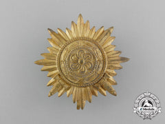 A First Class Ostvolk Decoration; Gold Grade With Swords