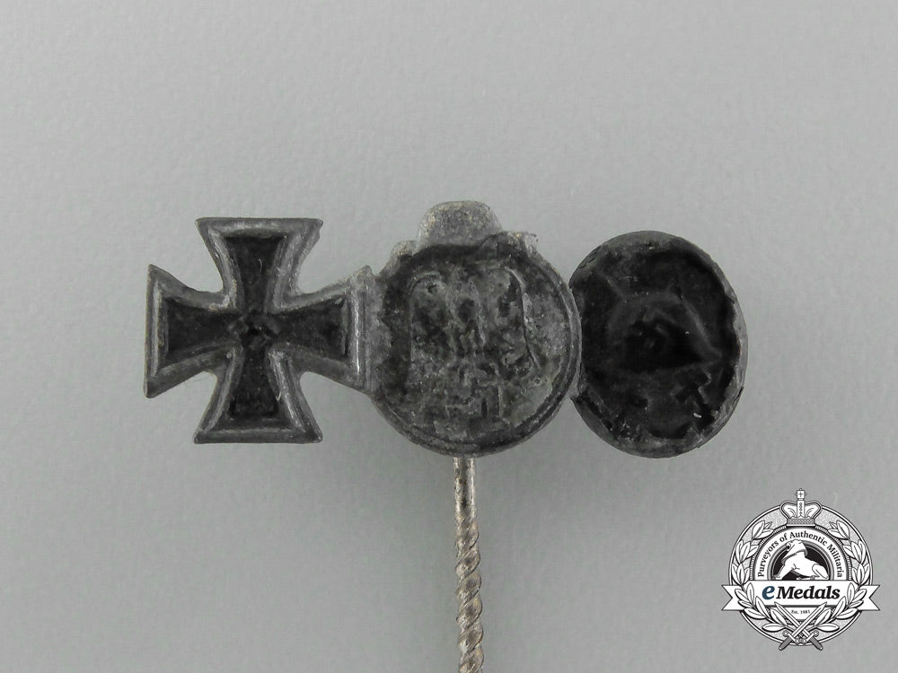 a_second_war_german_miniature_iron_cross_stickpin_grouping_on_its_ldo_salesman’s_board_e_4443