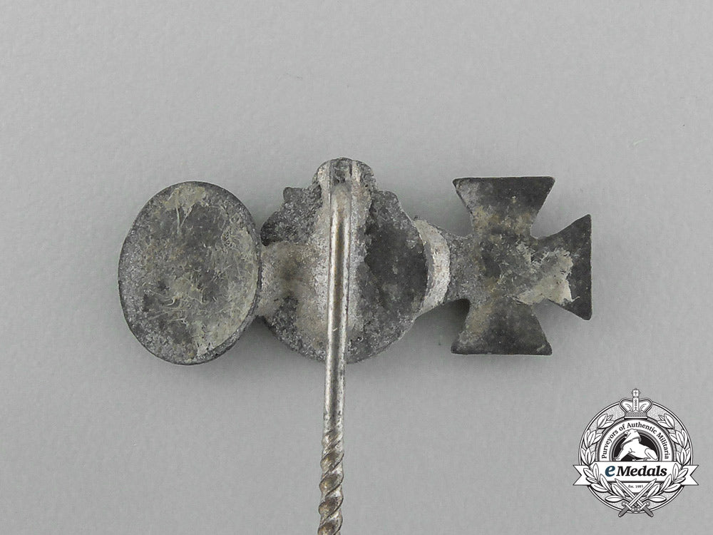 a_second_war_german_miniature_iron_cross_stickpin_grouping_on_its_ldo_salesman’s_board_e_4444
