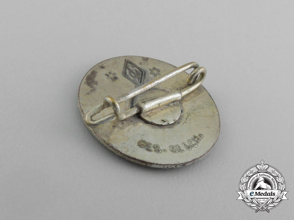 a“_now_more_than_ever”_nsdap_party_member’s_badge;_marked_e_4493_2