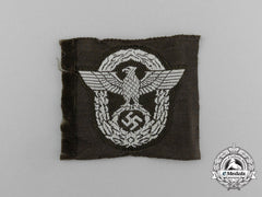 A Mint And Unissued Eastern People’s Police  M43 Overseas Cap Insignia